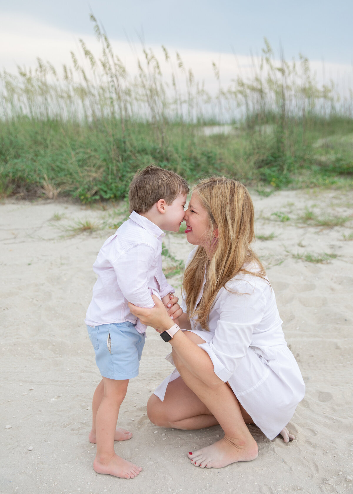 mother and son photographed in the beach dunes of jekyll island