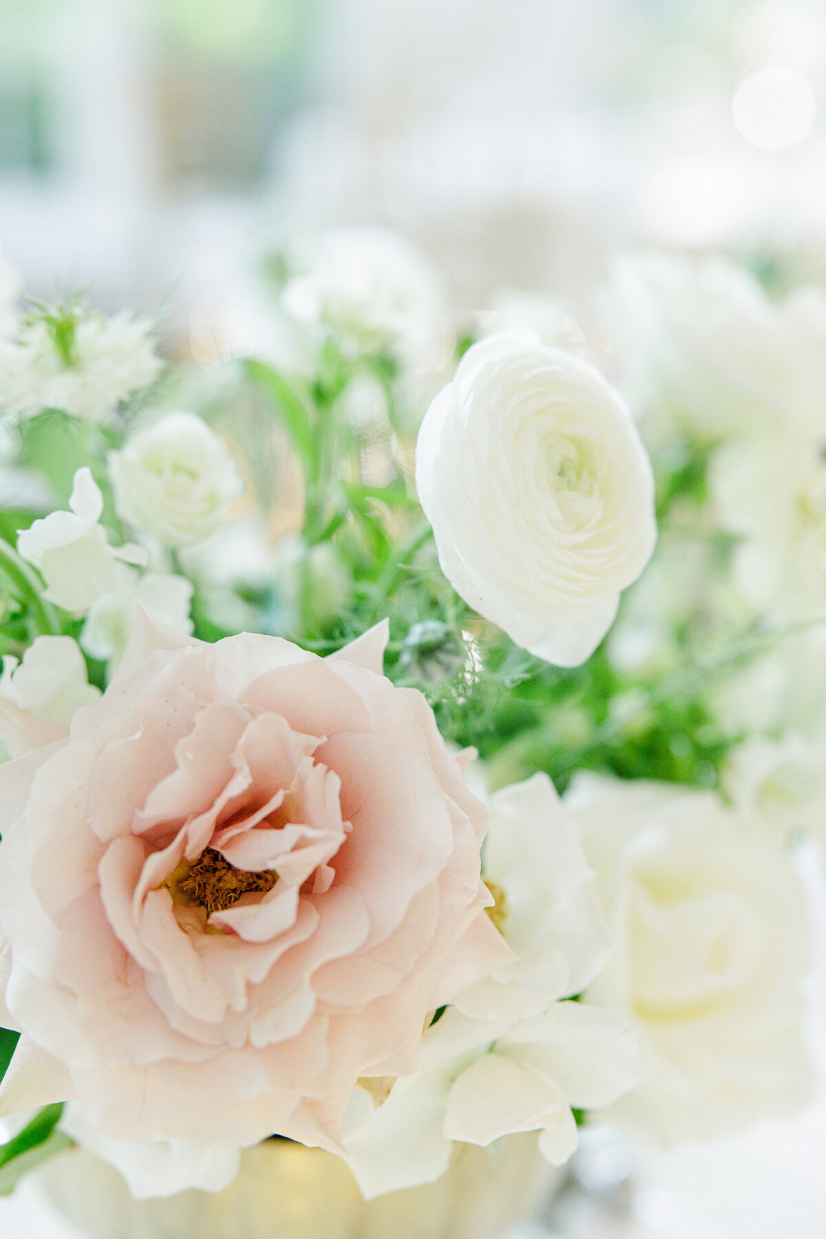Wedding floral table centerpieces with blush and white flowers