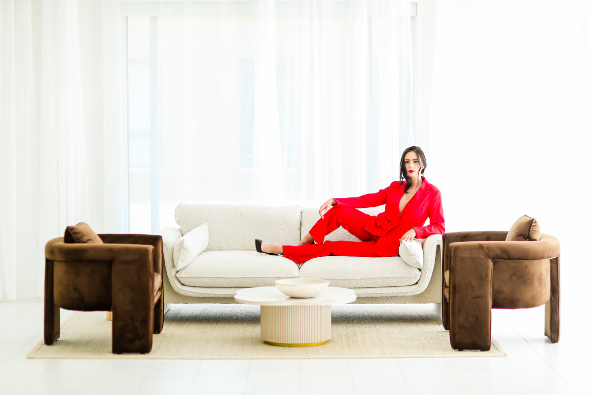 Model sitting, looking at camera