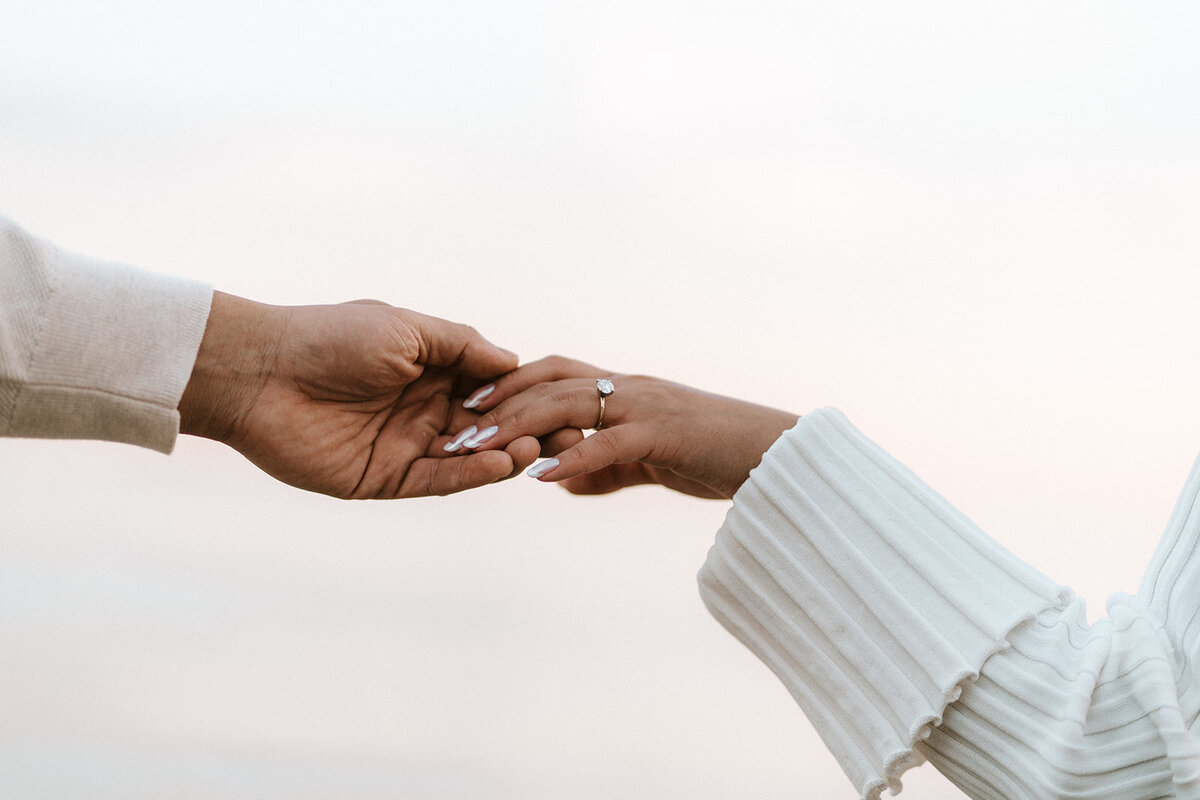 Two people holding hands