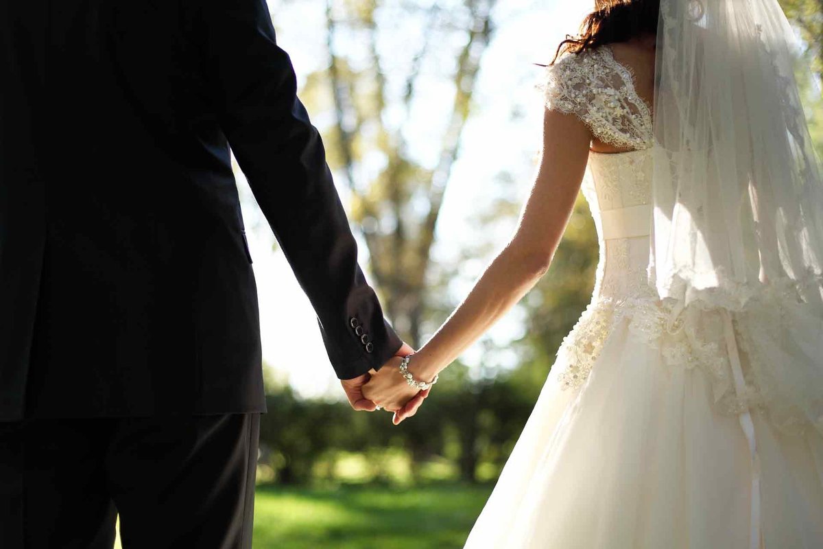Newlyweds Holding Hands after their ceremony
