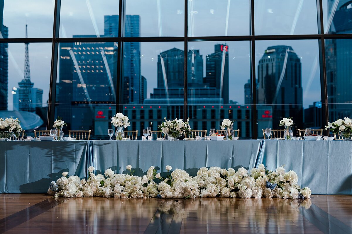Blue and white wedding at Country Music Hall of Fame with Nashville SKyline