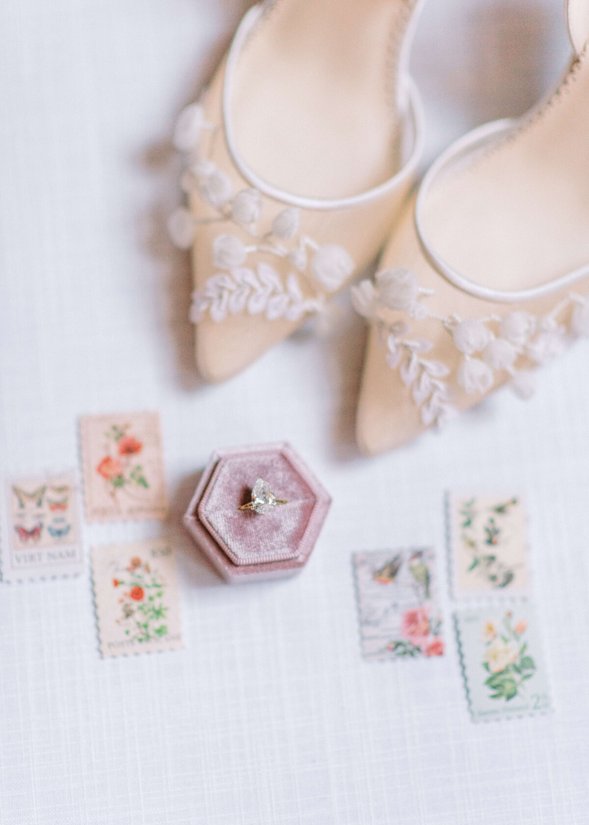 Beautiful engagement ring and floral lace wedding shoes  arranged for detail photos taken by Virginia Wedding Photographer Erin Winter