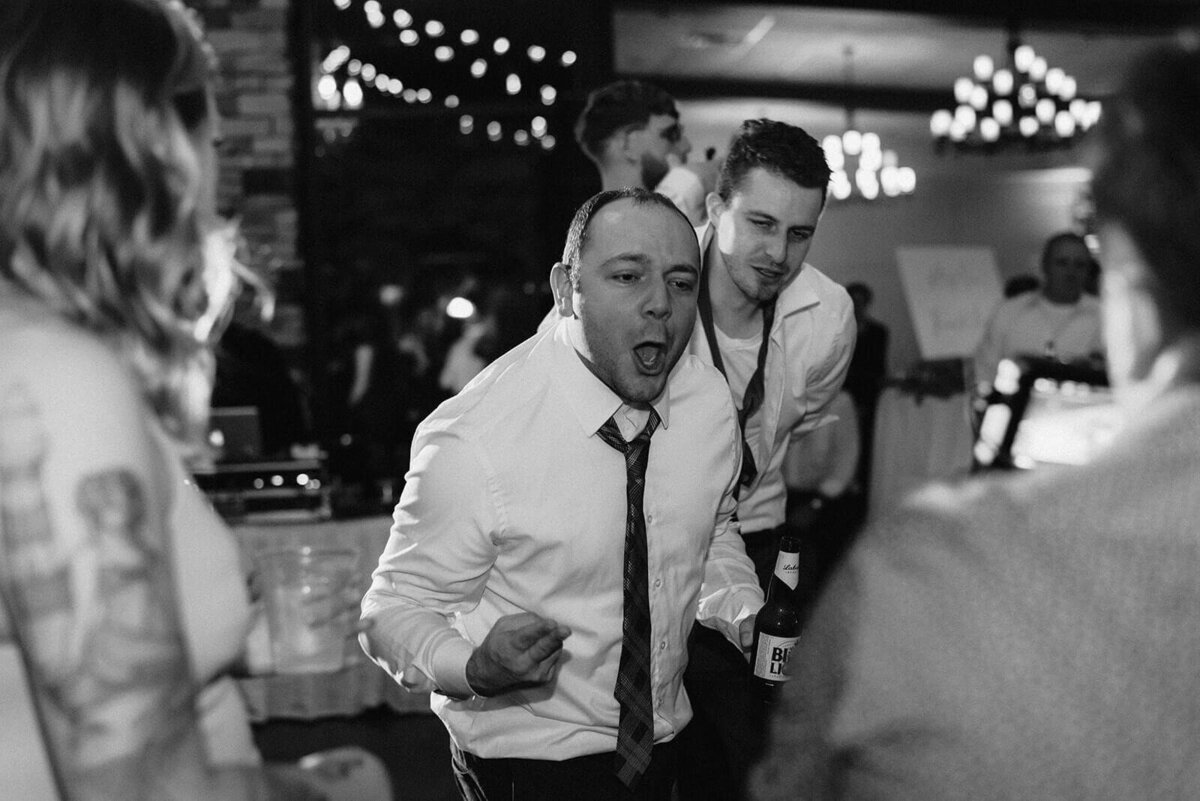 Groomsmen at wedding reception at Oswego, NY