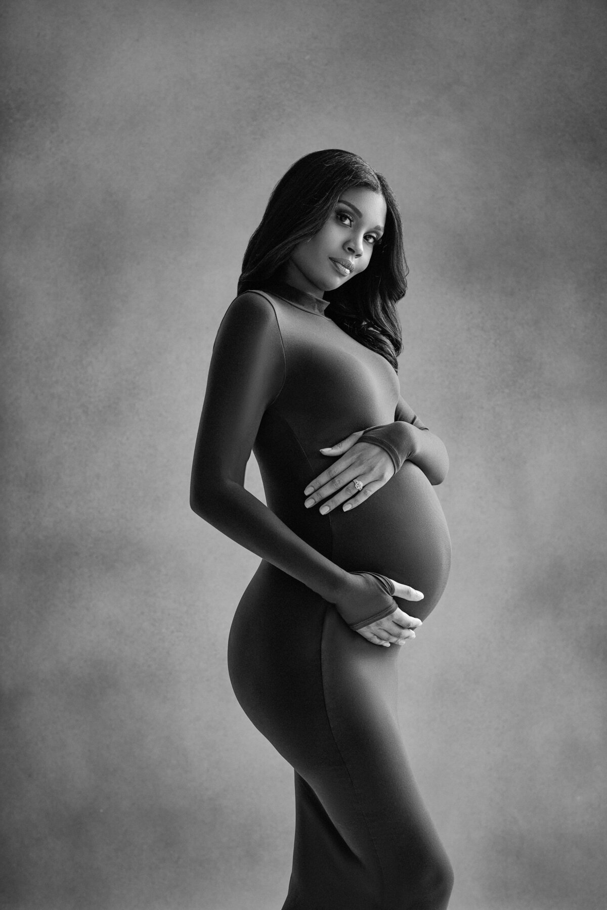 A pregnant woman holding her stomach