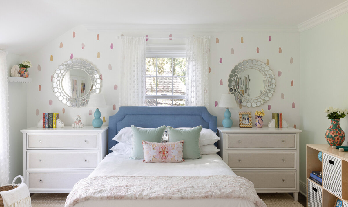 legant children’s bedroom in Summit, NJ designed by Deni + Dove Interiors. Featuring a tailored blue headboard, whimsical accent wall, and layered textures, this sophisticated space blends playful charm with high-end finishes—ideal for families seeking luxury interior design in Union County.