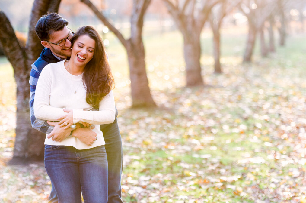 A couple embracing in an autumn park.