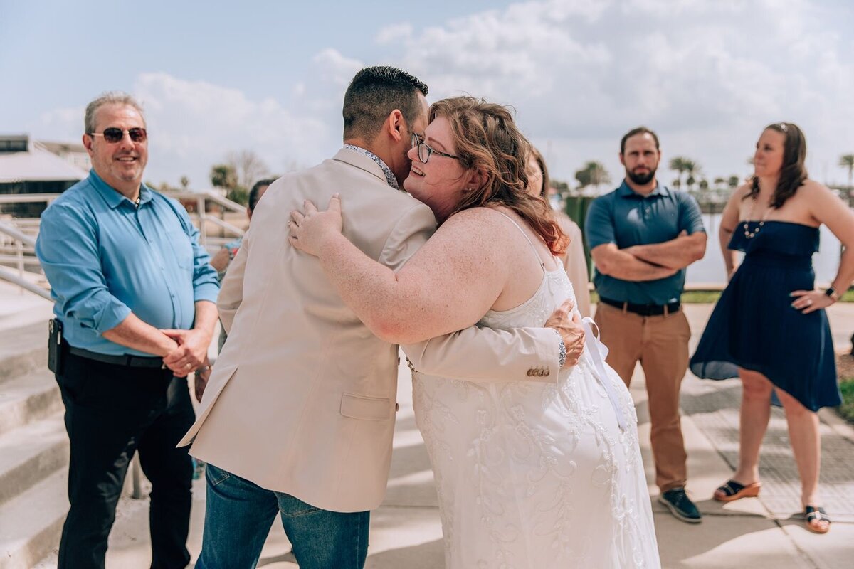 bride hugging one of her wedding guests