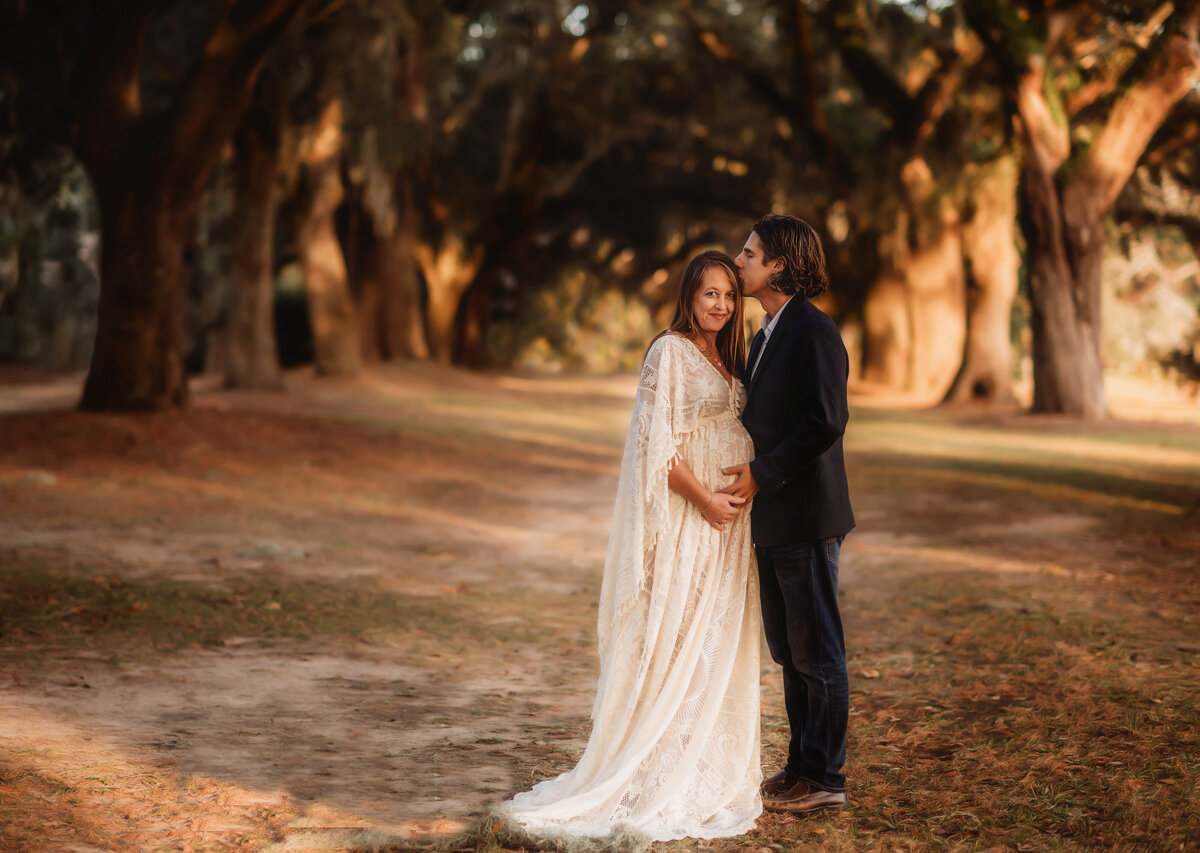 Pregnant woman poses for Maternity Photos at Charlestowne Landing  in Charleston, SC.