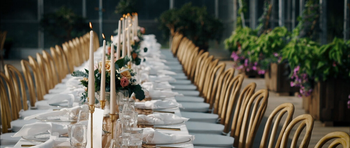 Elegant long reception table captured by Castano Films, modern wedding videographer in Calgary, Alberta. Featured on the Bronte Bride Vendor Guide.