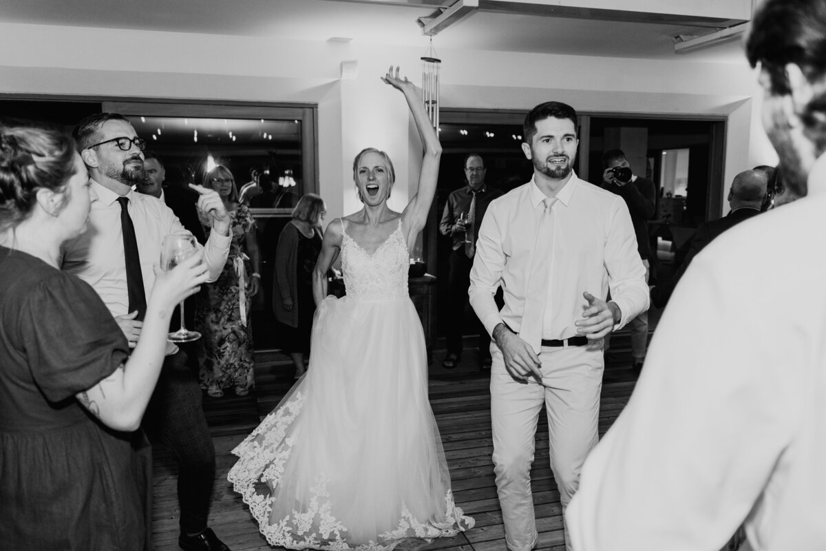 Bride dancing with friends during reception