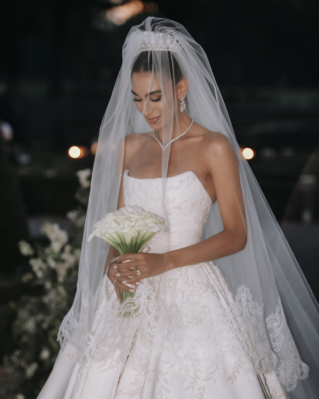 Paris Destination Wedding at Chateau de Chantilly by Alejandra Poupel Events Bride wearing her dress and bouqet 