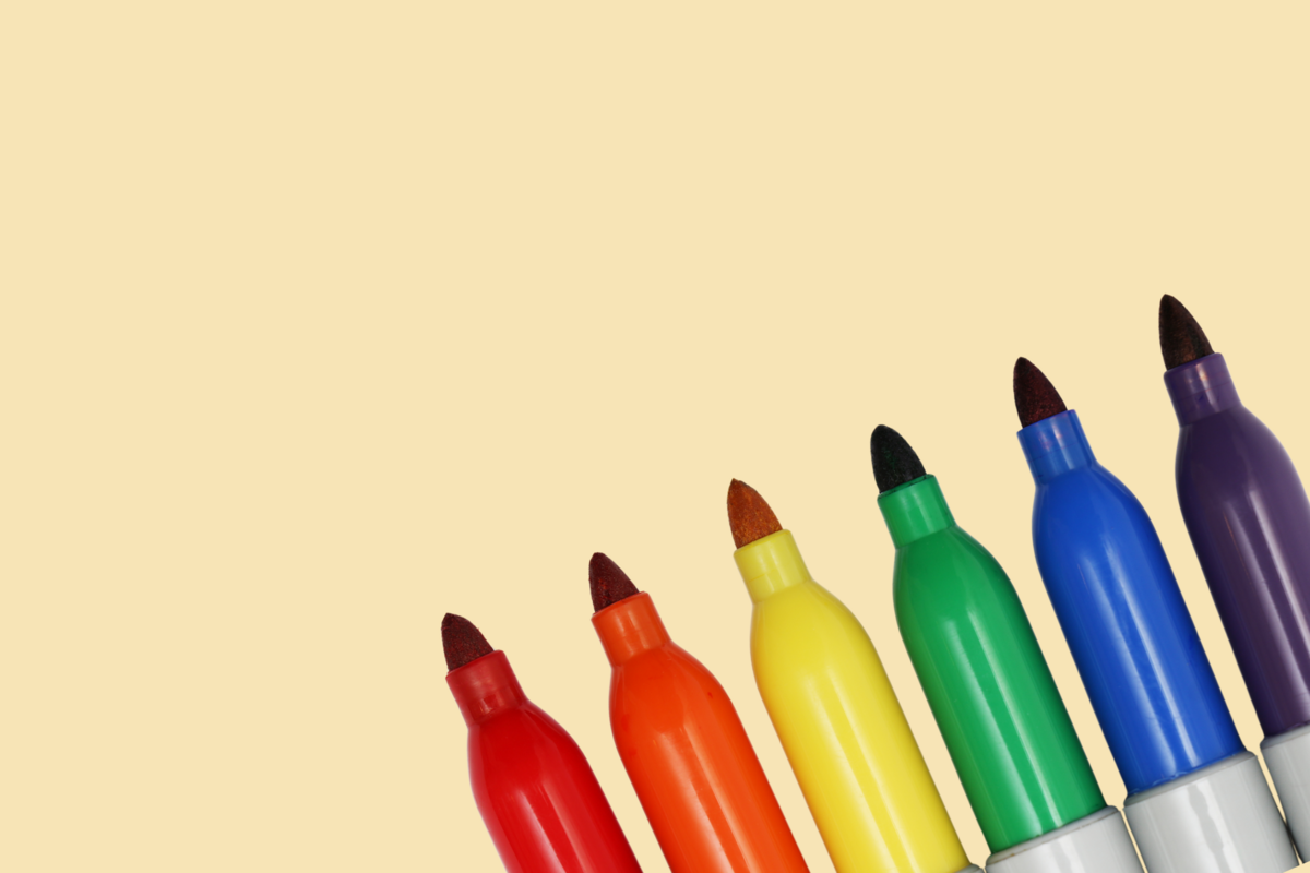 Sharpies against a yellow background