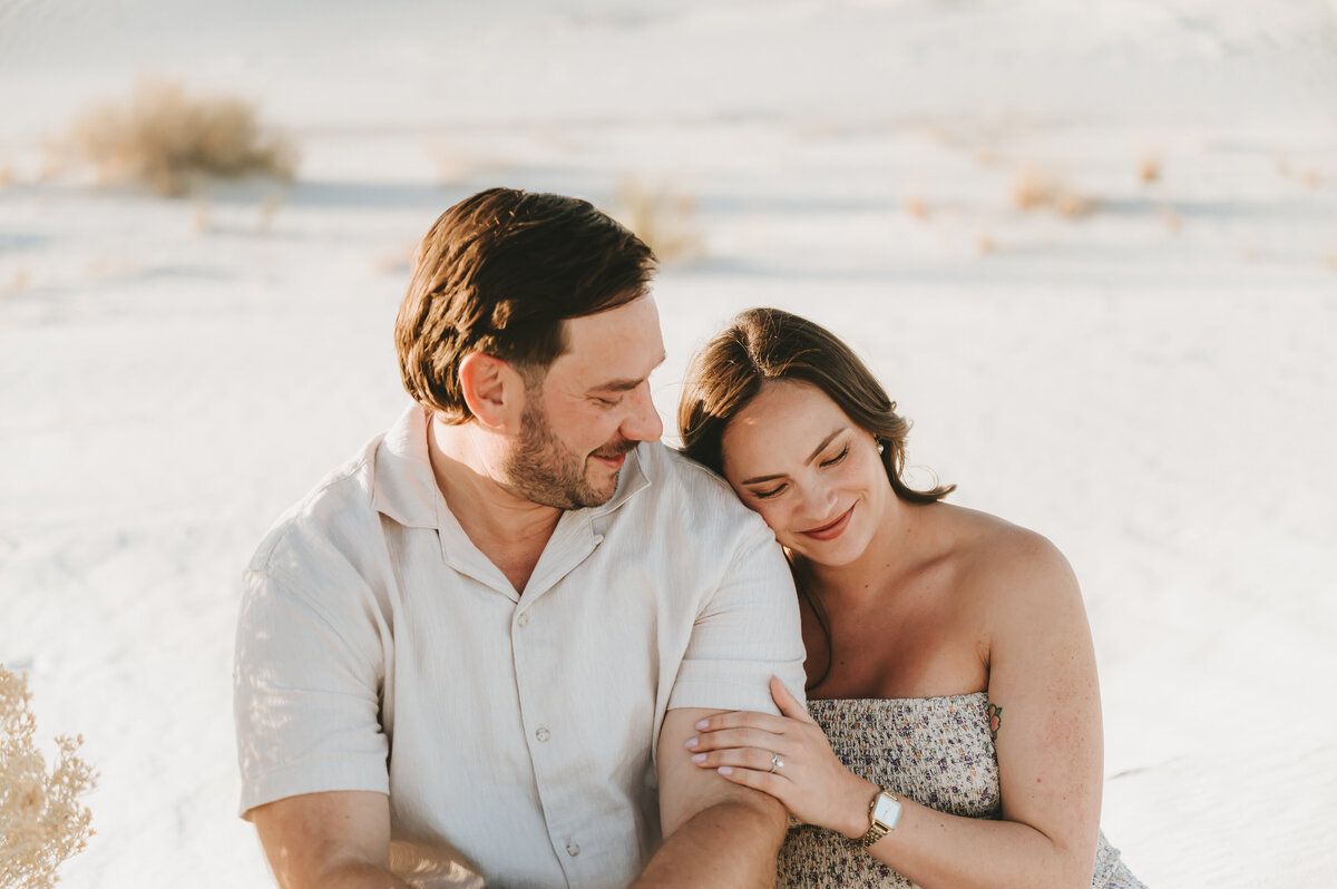 parents to be sitting at white sands