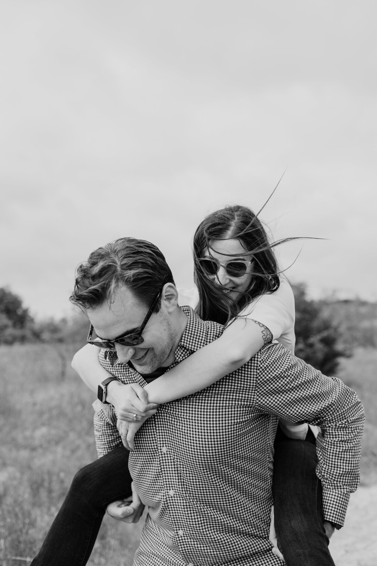 Candid and playful engagement session at Tandy Hills captured by Fort Worth Wedding Photographer, Megan Christine Studio