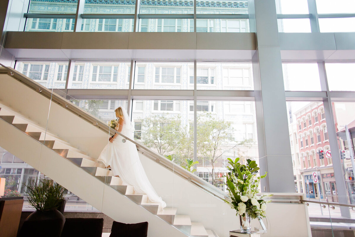 bride walking up the steps at the fairmont hotel in pittsburgh pennsylvania