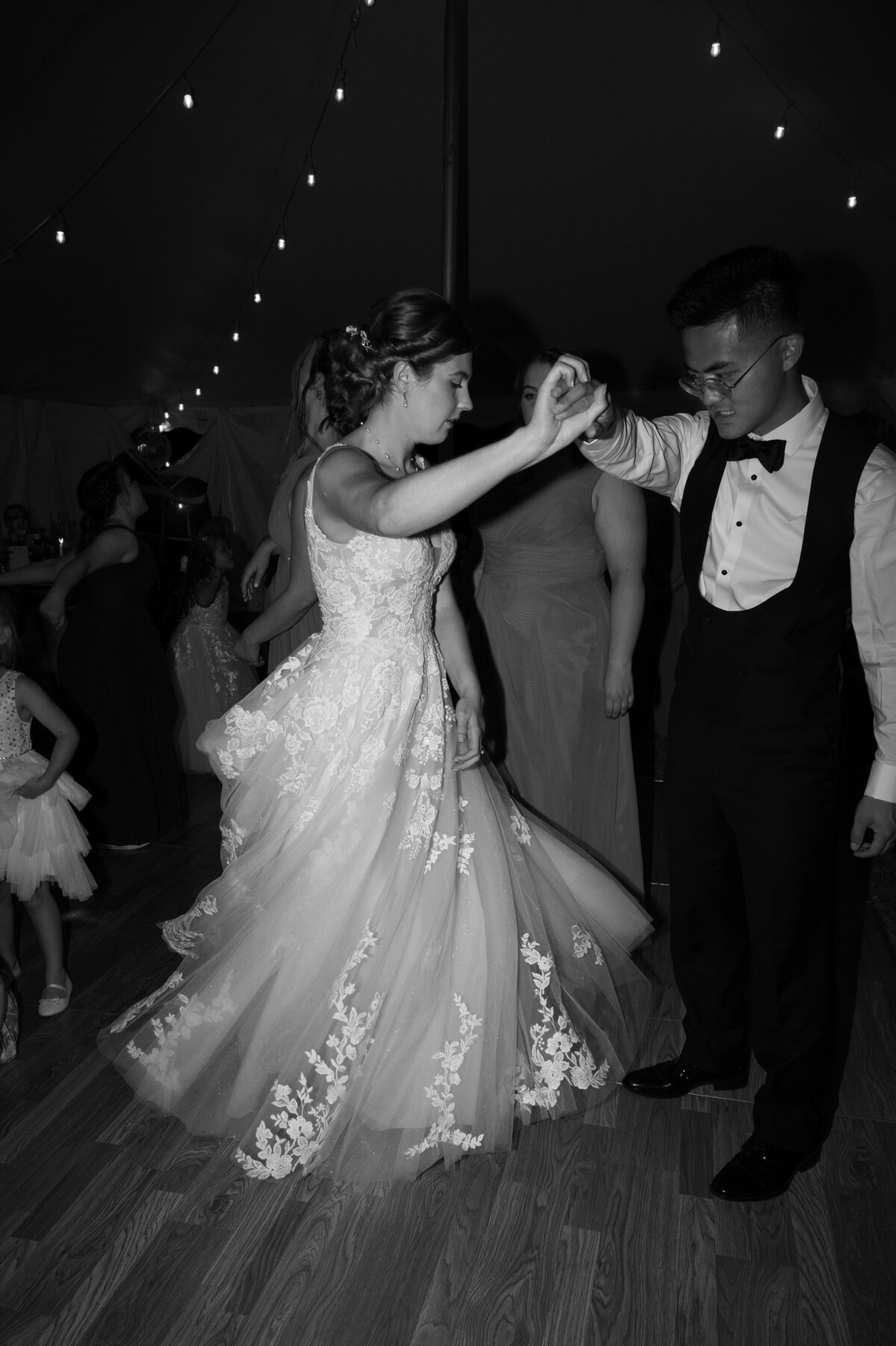A newlywed couple dancing together at their wedding