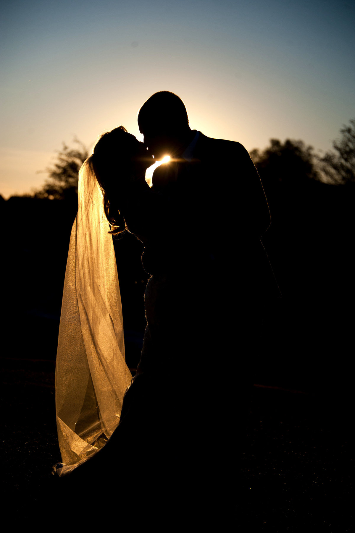 Outdoor sunset wedding photo for the Romantic Couple. Outdoor photographer for the fun sweethearts. Romantic Wedding Photo.