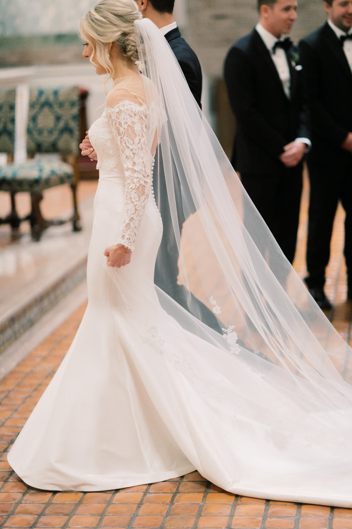 bride wearing off shoulder wedding gown with long veil at lancaster wedding