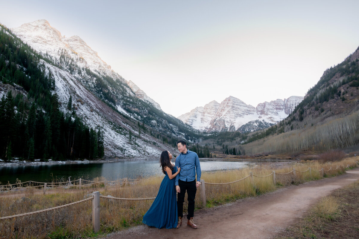 Maroon Bells Colorado elopement with Asian couple by snowy mountains and lake