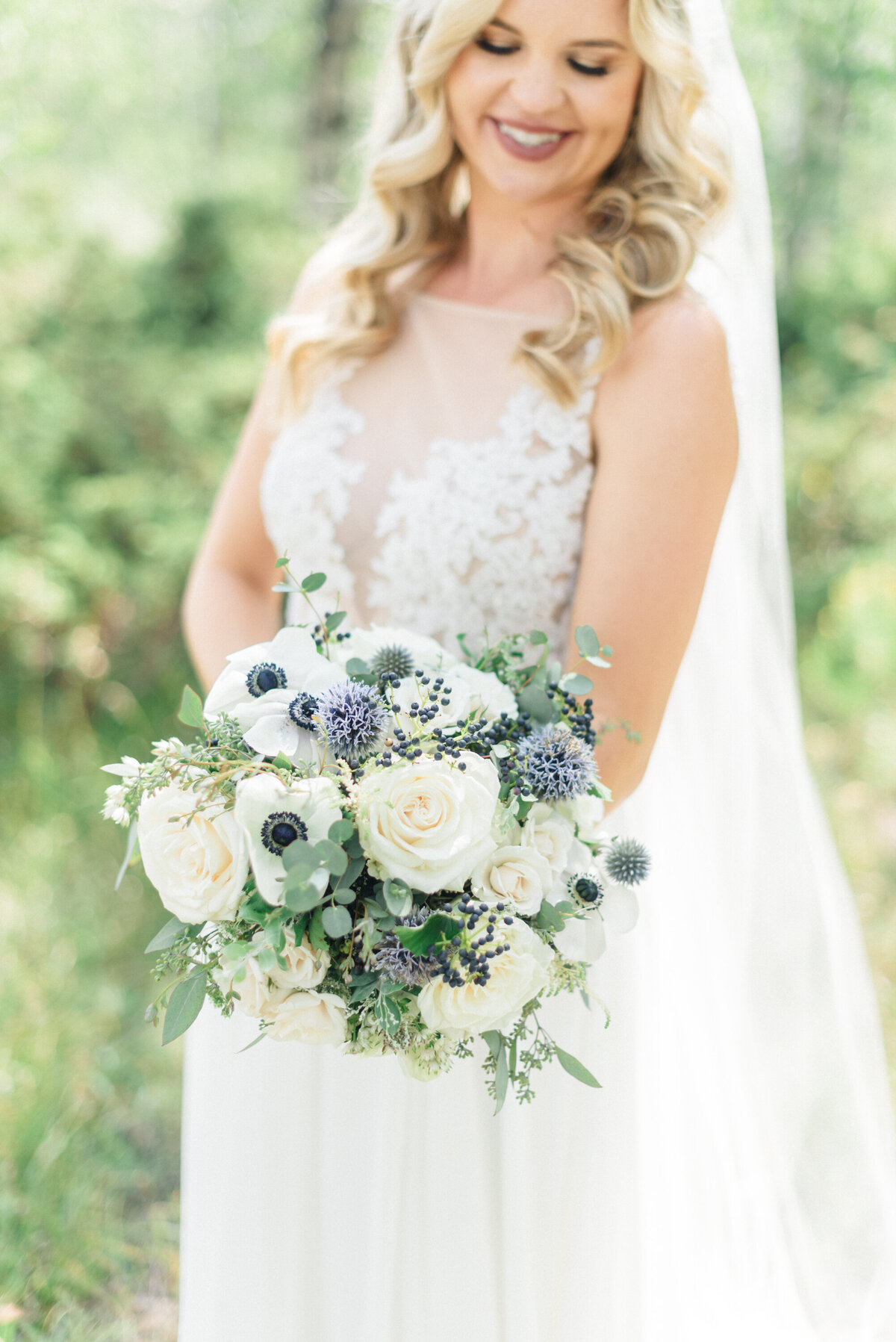 Summer Granby Wedding at the summit. Bridal portraits with aspens and beautiful florals.