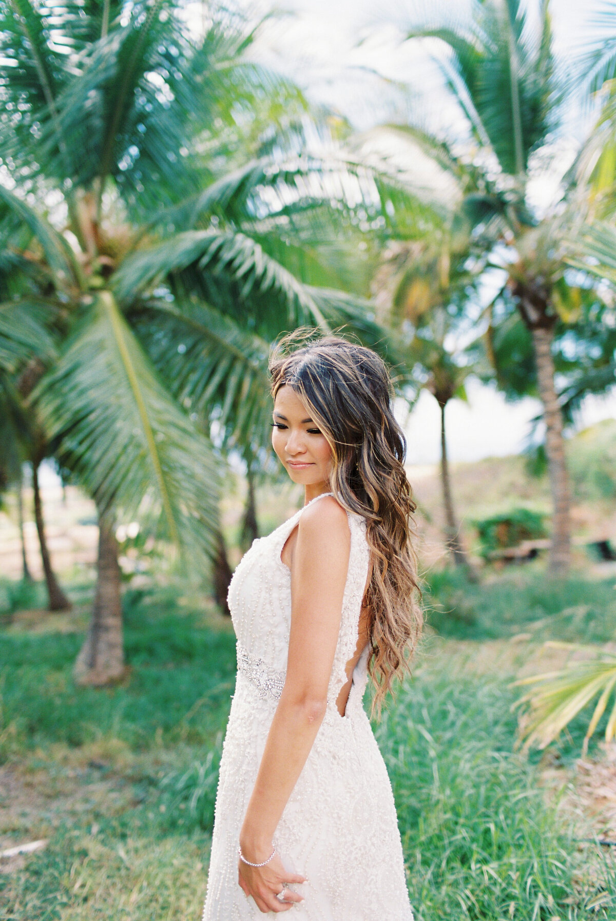 bride in front of palm tree