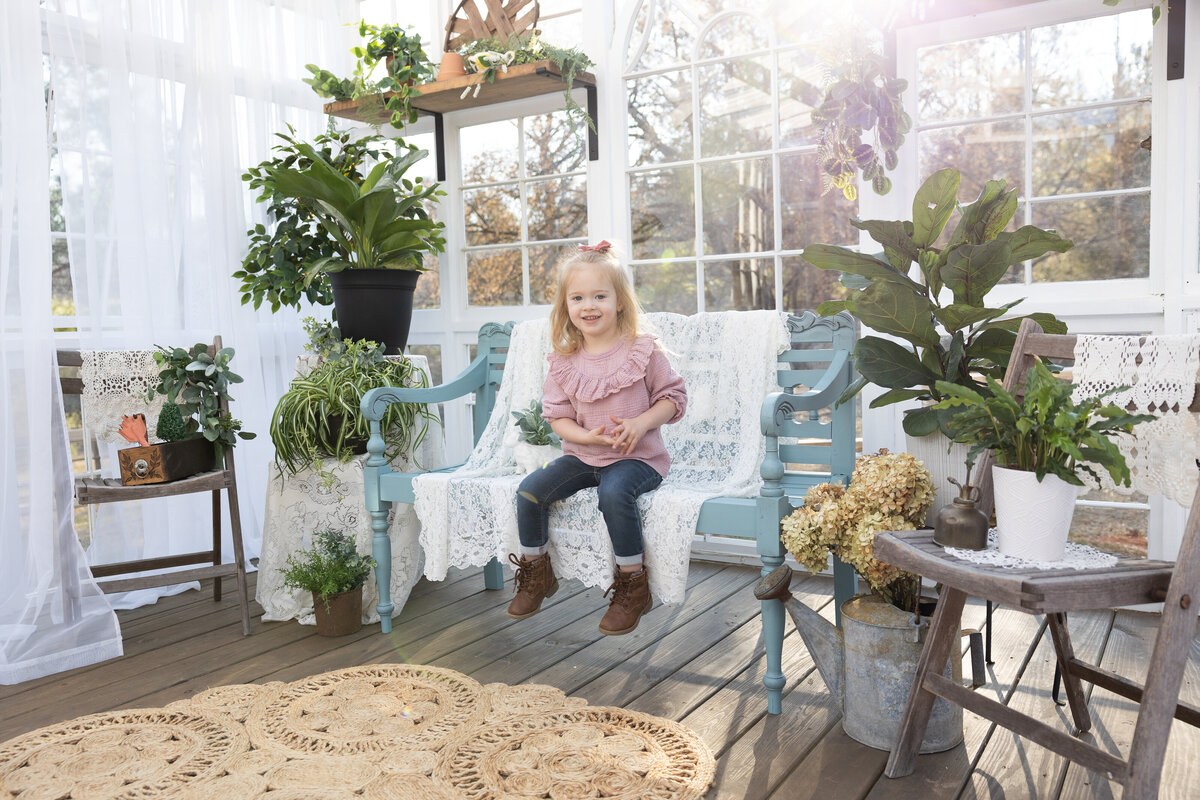 Toddler in Spring Greenhouse during Family and Children Session
