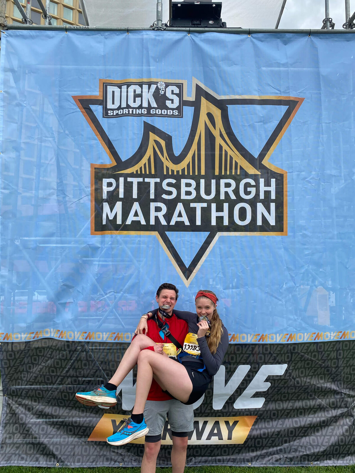 Michael Fricke holding his fiancee after they finish their first Pittsburgh half marathon
