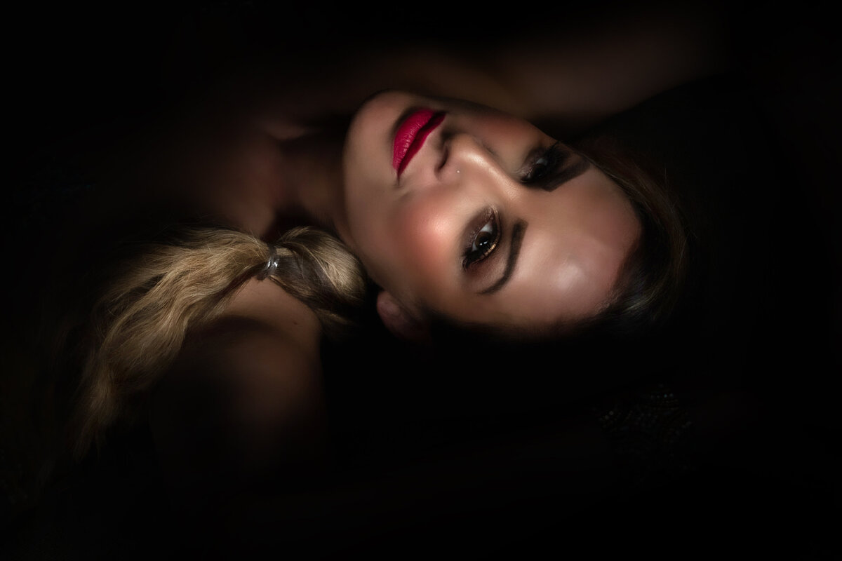 woman in bright red lipstick looking at camera