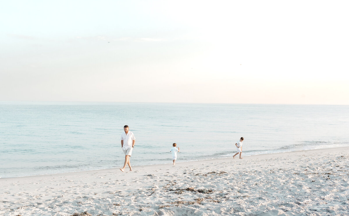 Dad-sons-walking-beach