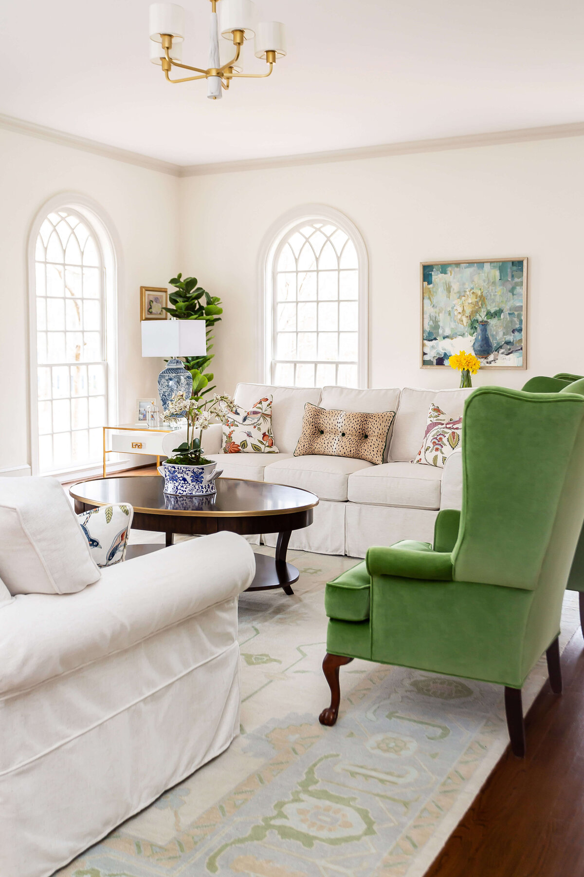 sweet southern home post project green armchair in white living room