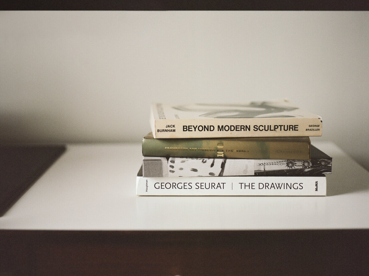 conceptual web designer brand photoshoot, film photo of art books, ALEO Detroit