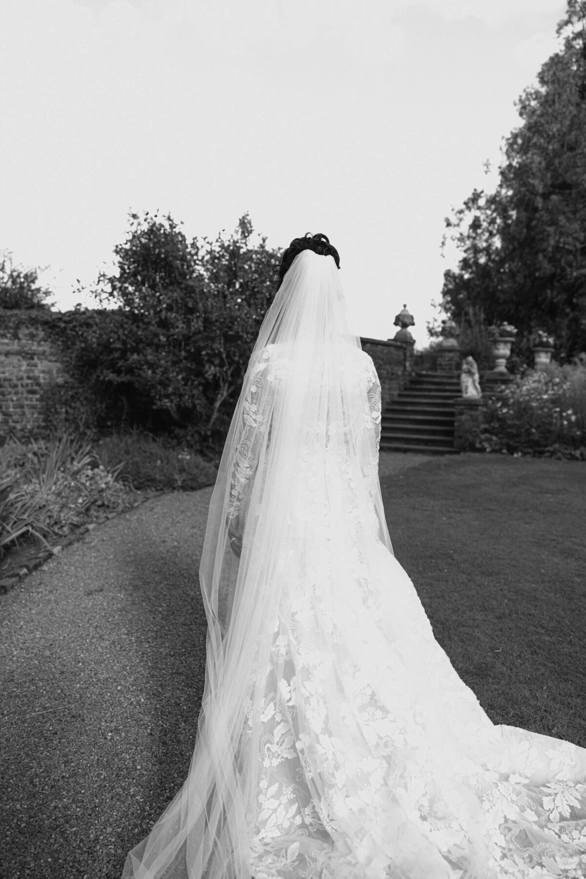 A black and white wedding photo of a bride in her white dress at Luttrellstown Castle