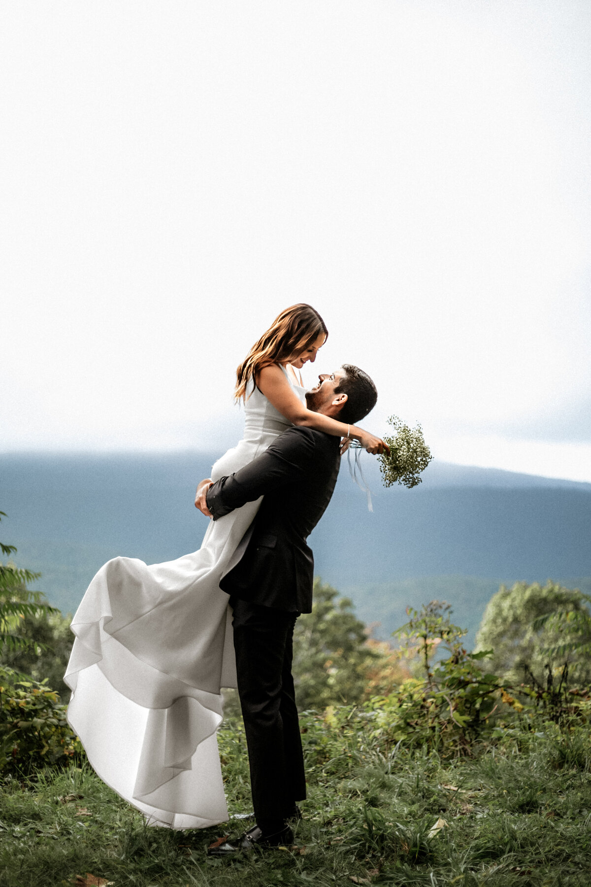 Salem VA wedding and Elopement photographer earthy and moody Charleigh Roberts Photography artsy earthy moody virginia roanoke va east coast blue ridge parkway nc elopement groom bride pick up