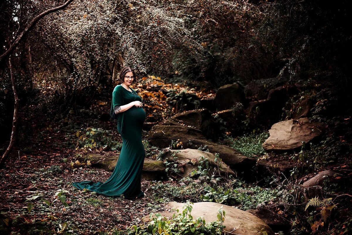 Pregnant woman in green dress at Queen Elizabeth Park