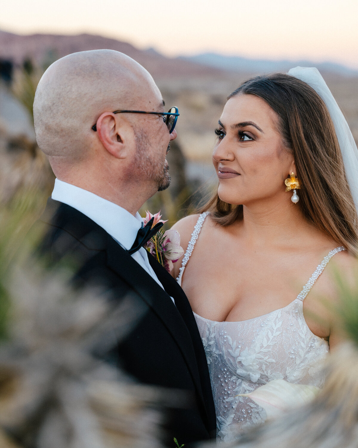bride and groom staring into each others eyes at red rock canyon just outside of las vegas, nv