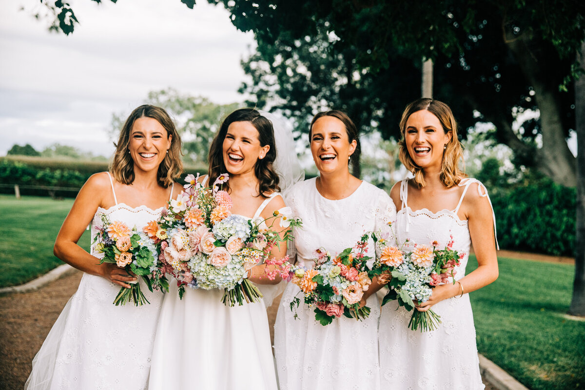 bride and wedding flowers southern queensland bridesmaids holding boquets