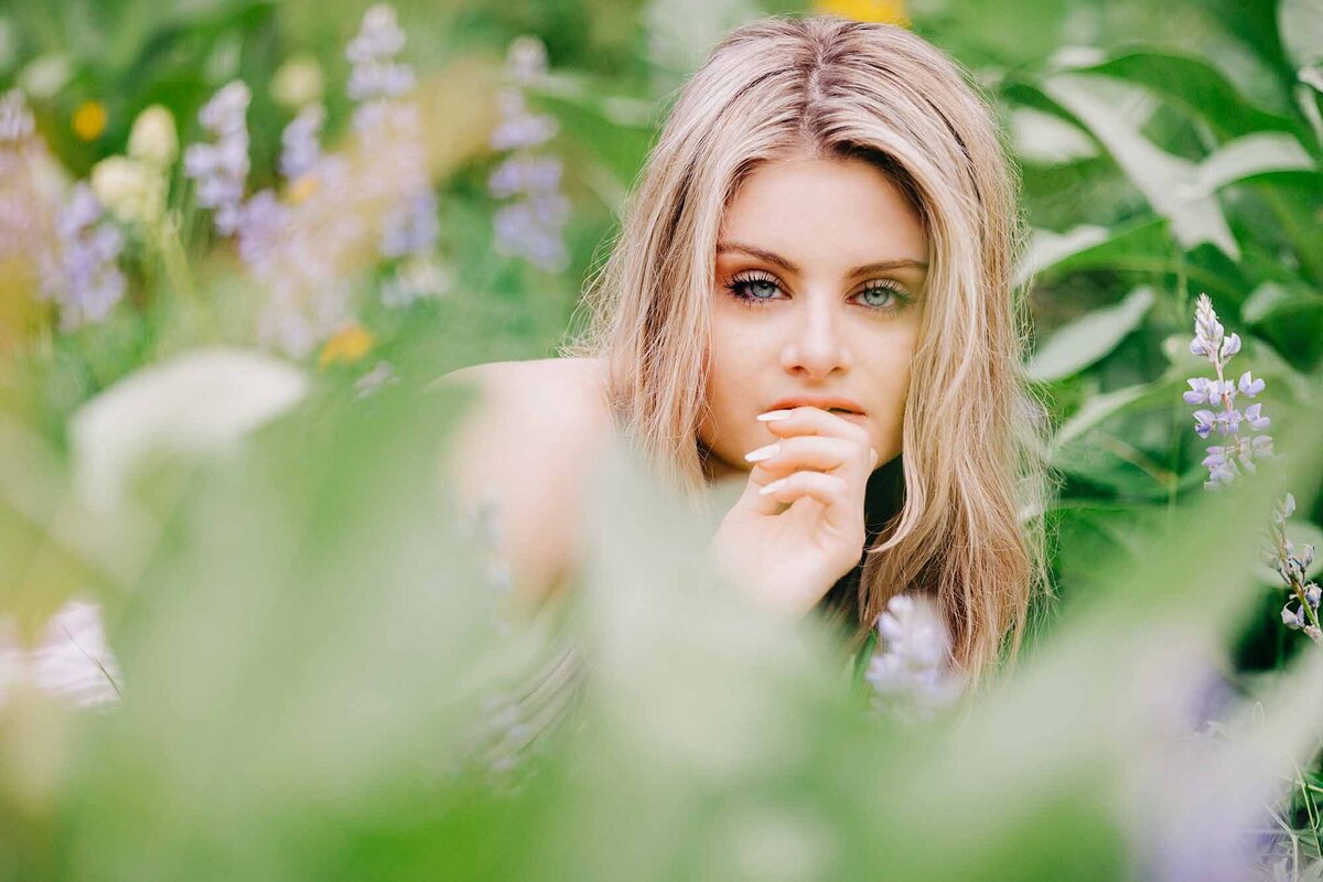 Portrait of Montana model laying in wildflowers, Pattee Canyon, Missoula