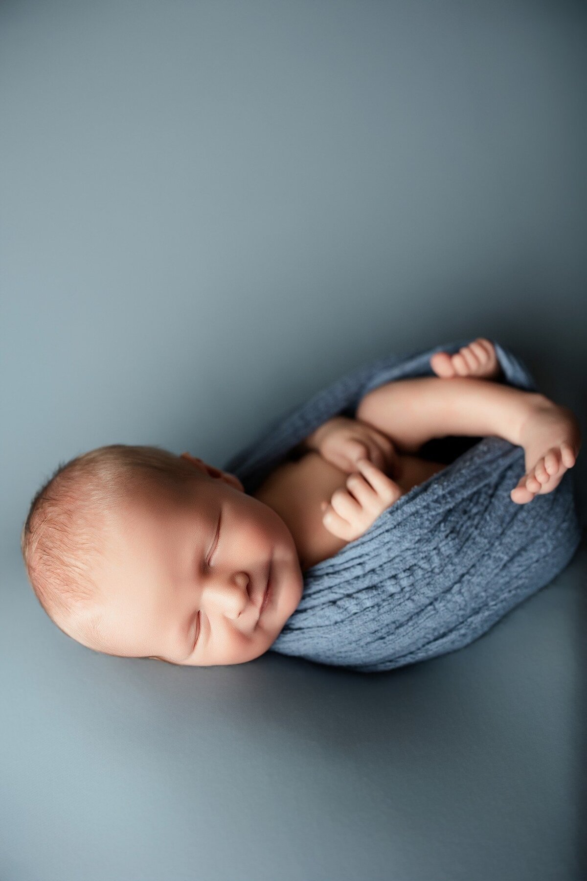 swaddled-newborn-blue-wrap-McKinney
