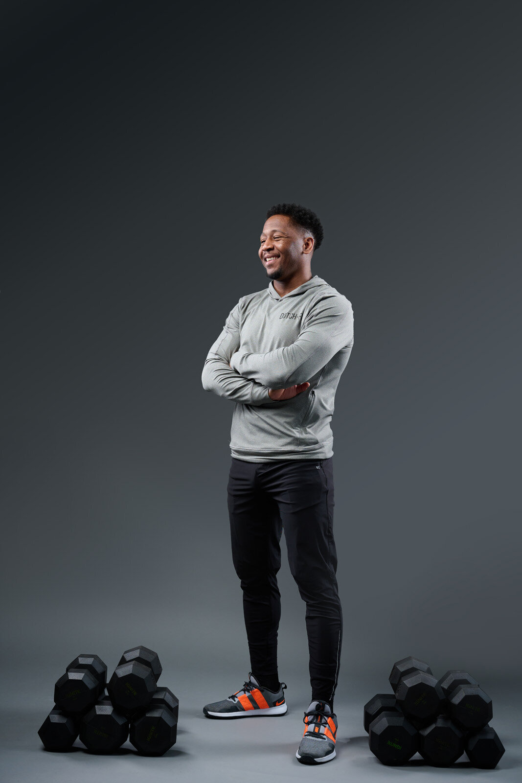Headshot Photographer in Edina Captures Fitness Enthusiast Smiling with Weights-28