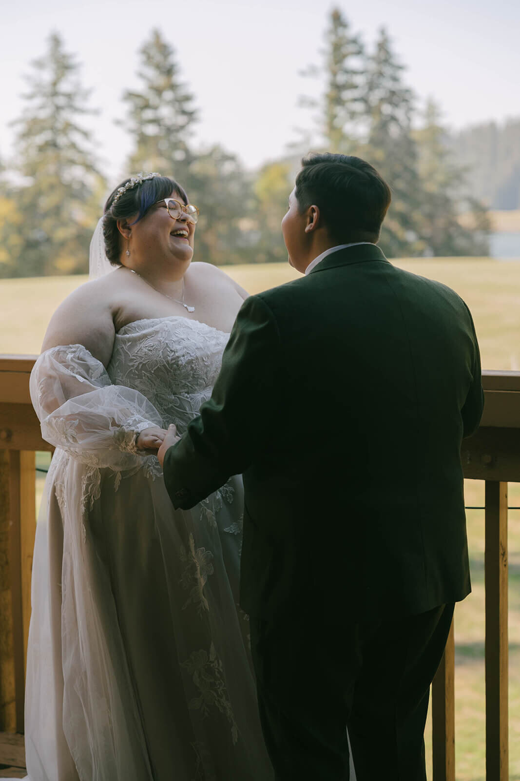 A couple smiling at each other during their first looks at Sky Camp Oregon Wedding Venue.