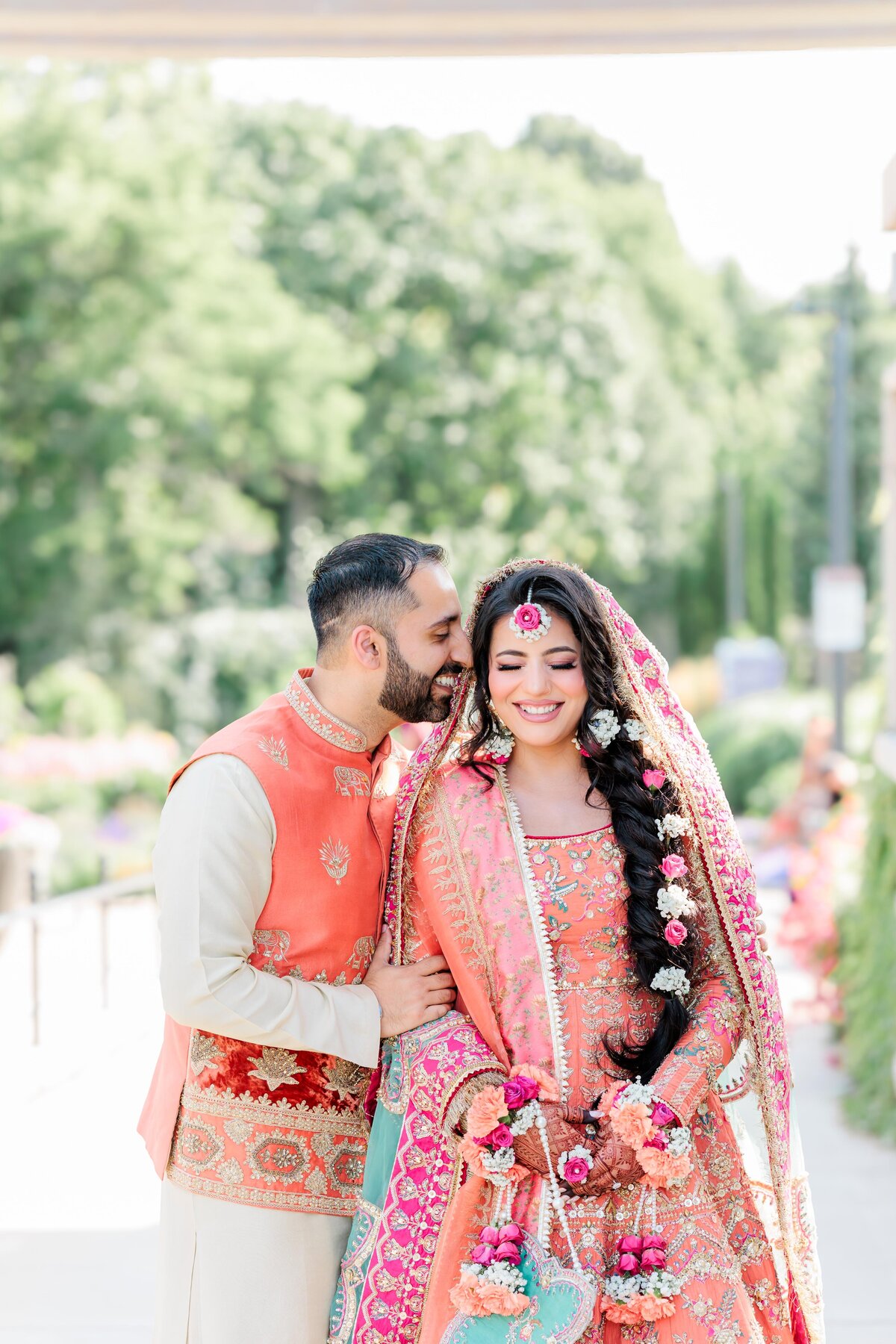 a pakistani couple dressed up in their mehndi outfit at the riverwood conservancy