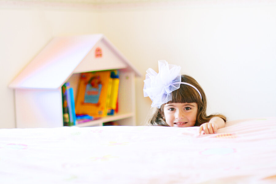 Natural portrait of a girl smiling in her family’s San Francisco home