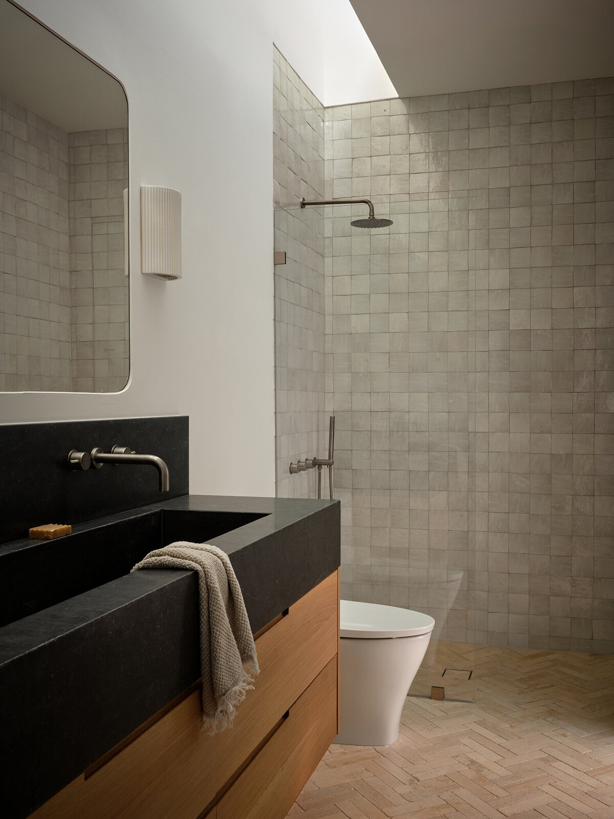 zellige-tile-travertine-herringbone-flooring-natural-oak-limestone-vanity-skylight-modern-timeless-bathroom-design-austin-home-house-franc