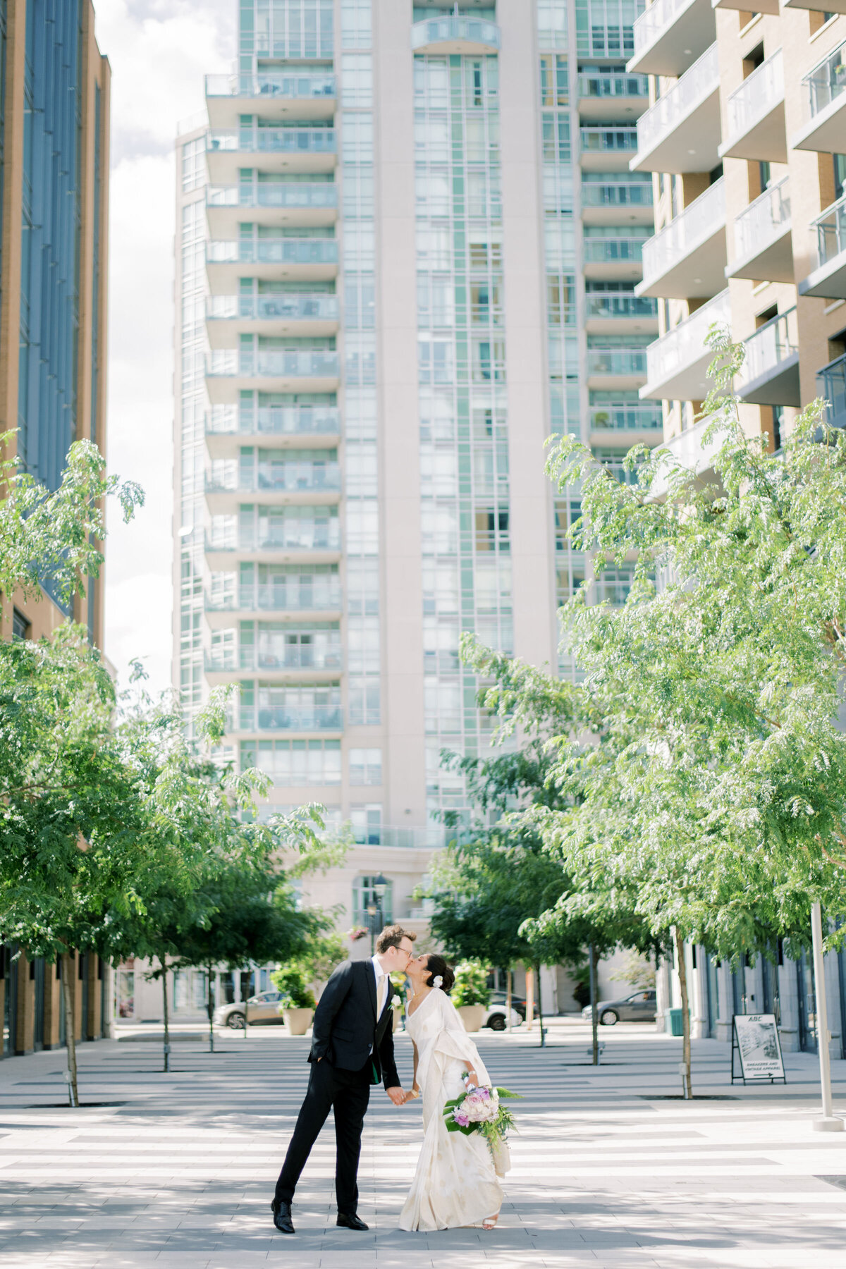 bride and groom having a kiss in the beautiful location at the pearle hotel in burlington