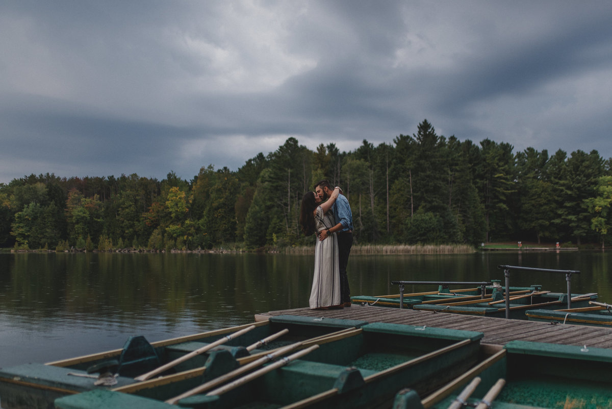 Romantic Stormy Engagement Session Rainy Pond Rowboat Kelly Green Summer night | Jacqueline James Photography