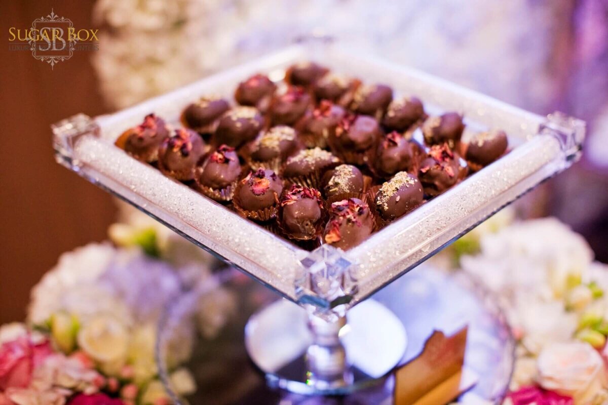 Assortment of petit fours on a crystal cake stand