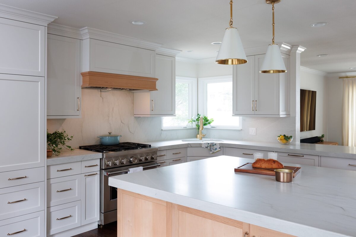 the keeping room interiors oakview kitchen with whtie island and hanging pendants