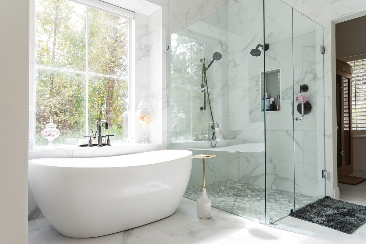 dewine design orlando interior designer modern lakehouse bathroom with large window and walkin shower