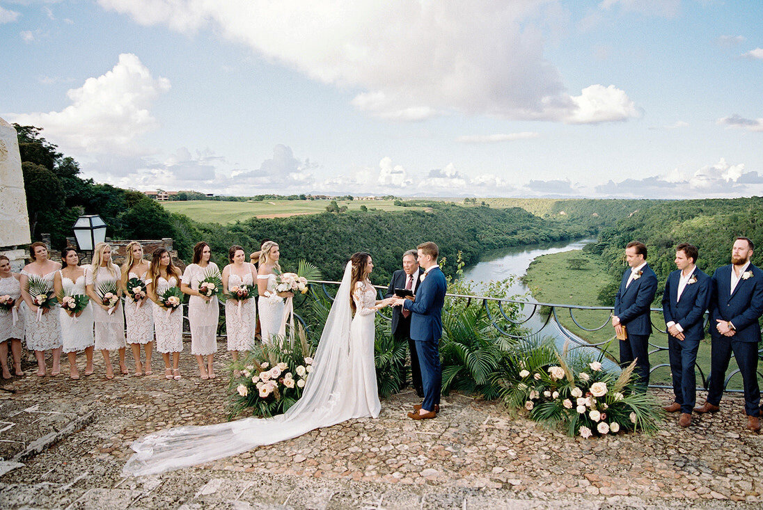 Bridesmaids and groomsmen at a ceremony during a destination wedding